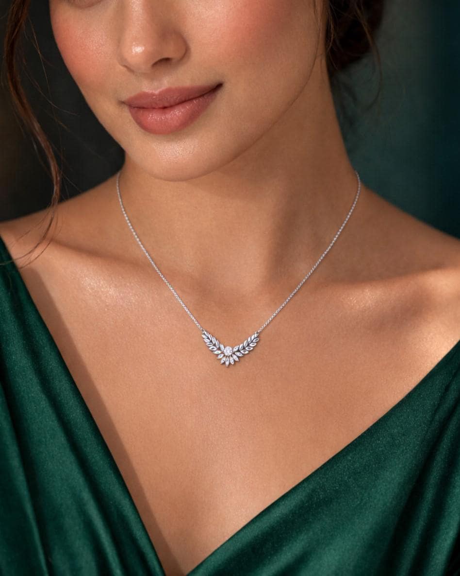 Gold rose gold moissanite laurel leaf pendant necklace with minimalist diamond-style design, perfect for bridal jewelry by Riora.