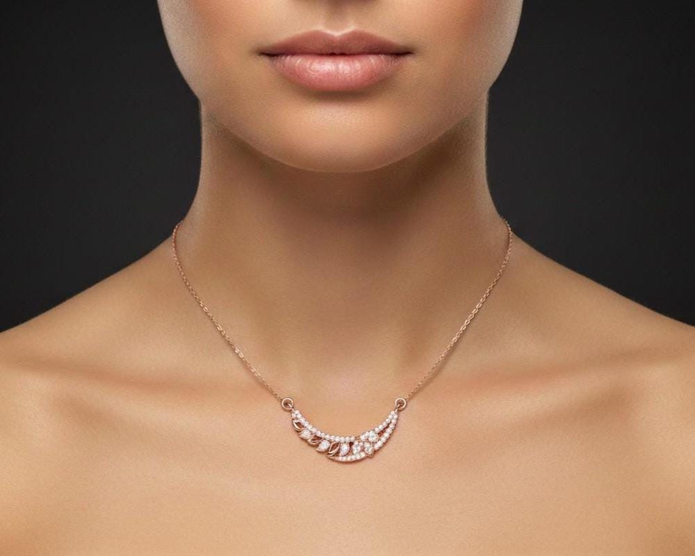 Rose gold leaf necklace with sparkling moissanite diamond accents, minimalist bridal jewelry for women, elegant wedding pendant.