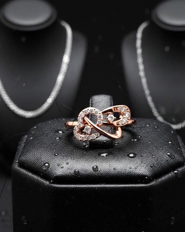 Rose gold infinity heart moissanite diamond promise ring with minimalist romantic design, perfect for love and anniversary jewelry.