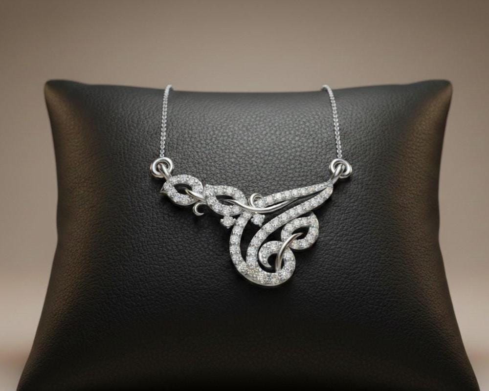 Riora moissanite swirl pendant necklace in gold, rose, and silver with elegant design, perfect for bridal or anniversary jewelry.
