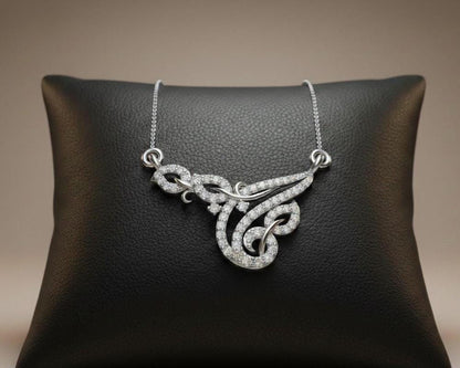 Riora moissanite swirl pendant necklace in gold, rose, and silver with elegant design, perfect for bridal or anniversary jewelry.