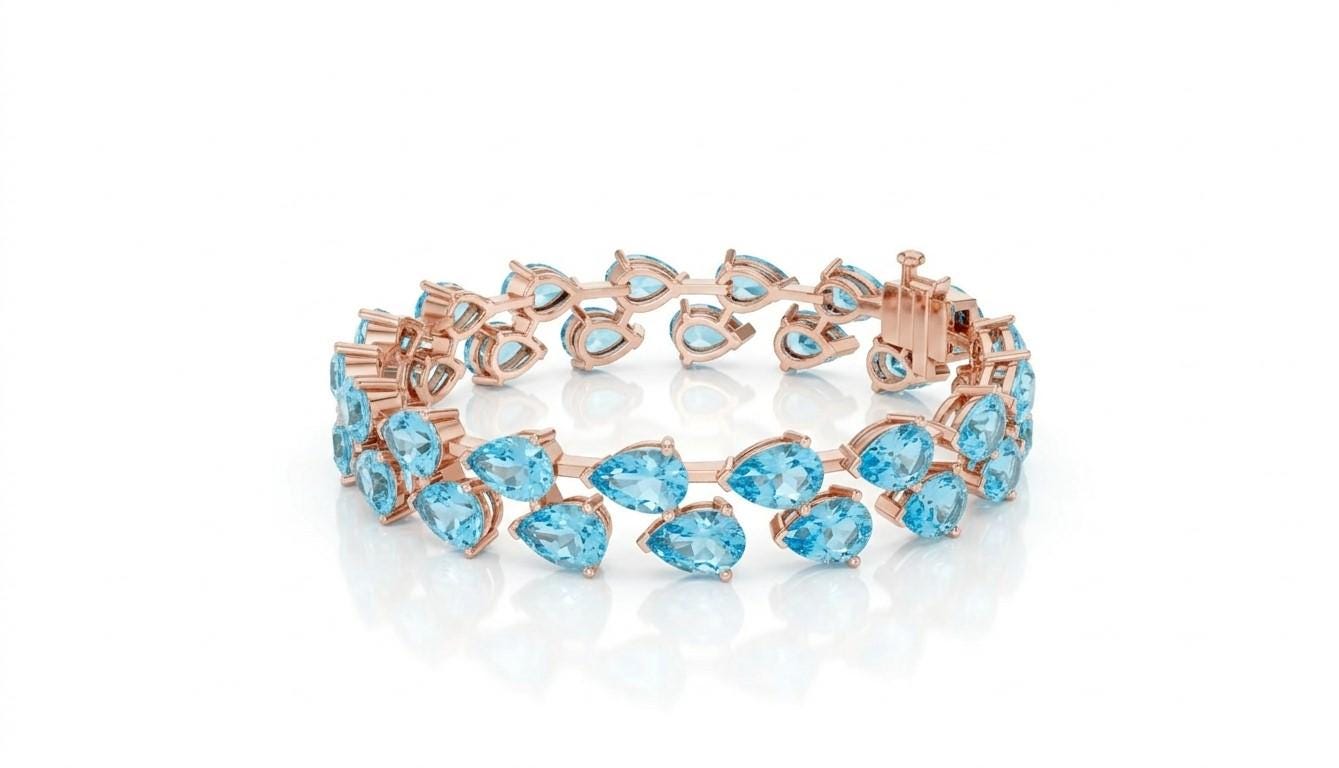 Pear cut moissanite diamond tennis bracelet in rose gold featuring delicate, elegant bridal jewelry design by Riora.