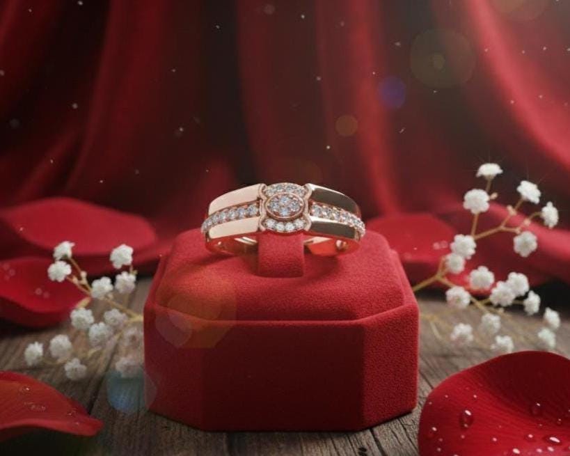 Elegant diamond halo rose gold engagement ring by Riora, featuring a dainty design and sparkling gemstones for bridal jewelry.