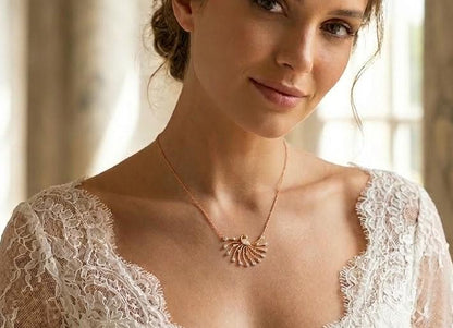 Rose gold moissanite peacock necklace with intricate pendant, elegant bridal jewelry for weddings and special occasions.
