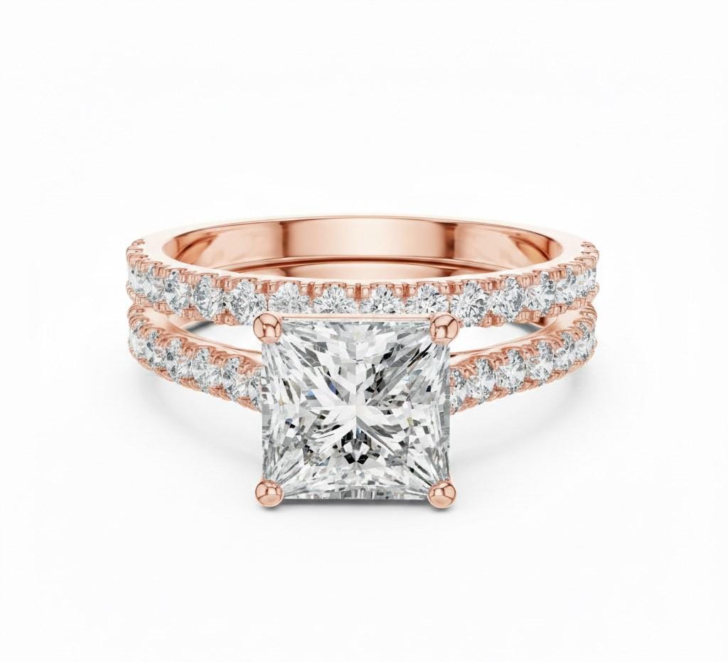 Riora princess cut moissanite diamond engagement ring set with halo and matching wedding promise band on a white background.