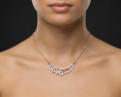 Rose gold teardrop necklace with a sparkling moissanite pendant, elegant bridal jewelry for weddings and special occasions.